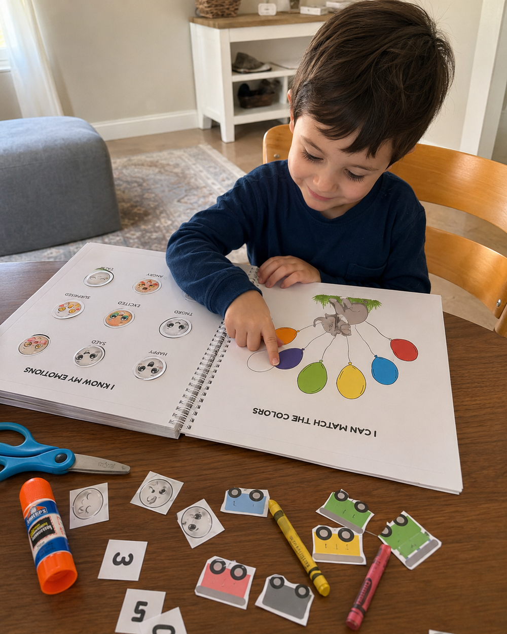 Child matching colors and emotions in a printable activity book at a table